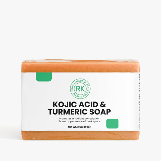 Bar of soap with Kojic Acid and Turmeric on a white background
